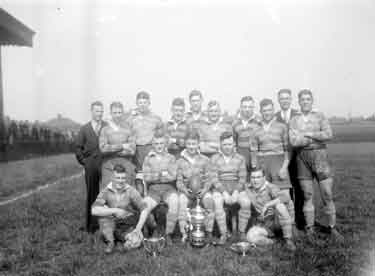 Rugby team with cup