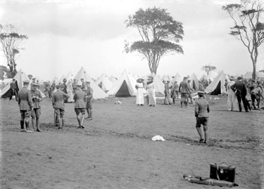Kings Own Yorskhire Light Infantry at camp with two ladies