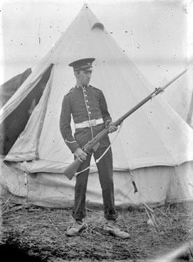 Soldier posing with rifle