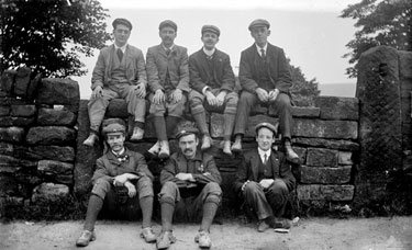 Workers sitting on wall