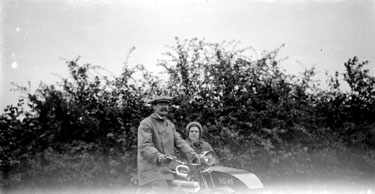 Man and Woman in motorcycle and sidecar
