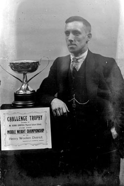 Portrait of man with Challenge Trophy, Middle Weight Championship