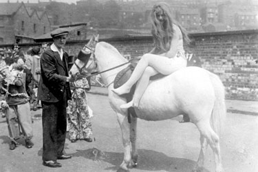 Fancy dress parade, woman sat on horse
