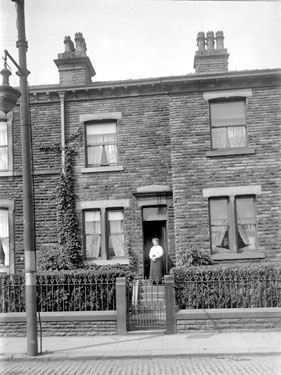 Woman standing on doorstep of house, Dewsbury?