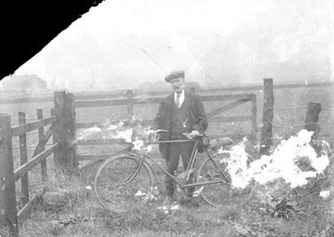 Man in garden with bicycle