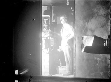 Cinema projectionist at work