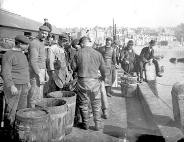 Scarborough, men unloading fish
