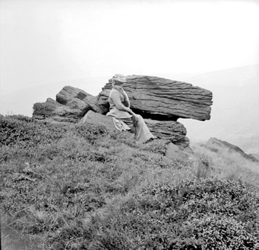 Woman sitting at Headingley Rocks, Wessenden