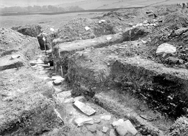 Roman Camp, Slack: centre wall Barrack buildings, cross wall, tiled hearth, rods in wall angles, from S.W.