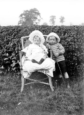 Young Girl and Boy in Garden