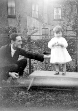 Man with young girl in Garden