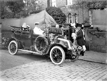 Car with chauffeur and passengers
