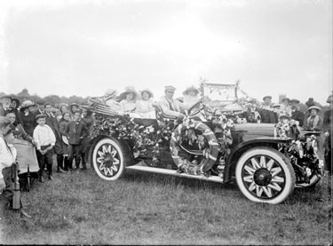 Decorated Car with passengers and crowd, Alexandra Day in park