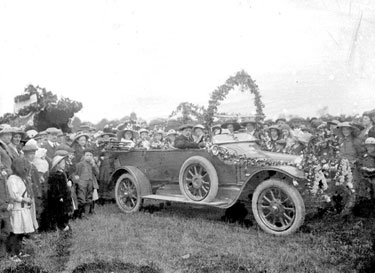 Car decorated for Alexandra Day, with crowds