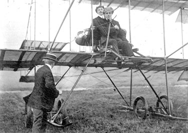 Aeroplane with two men sitting on it