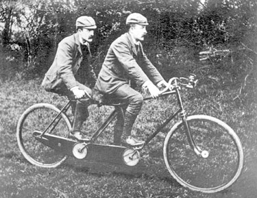 Men on tandem bicycle, from photograph