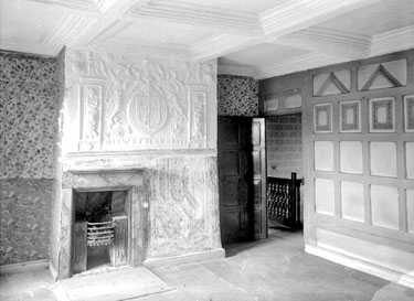 Granny Hall, Brighouse: interior showing Coat of Arms over one of the bedroom fireplaces.