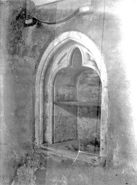 Ouston Church interior, irregular arched window