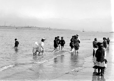 Children paddling in sea at New Brighton
