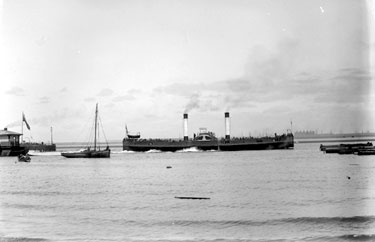 Two funnel steamer ship leaving New Brighton pier with other boats