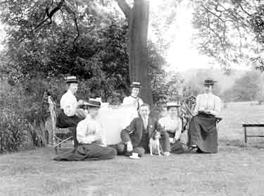 Group having tea on the lawn