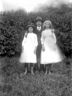 Portrait of man and two girls