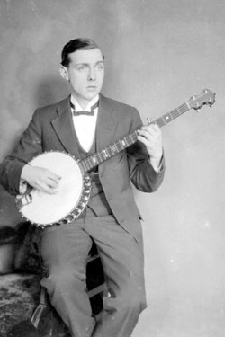 Portrait of Mr J Hayes playing banjo