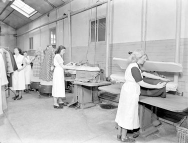 Thomas Broadbent & Sons Ltd: women pressing clothes