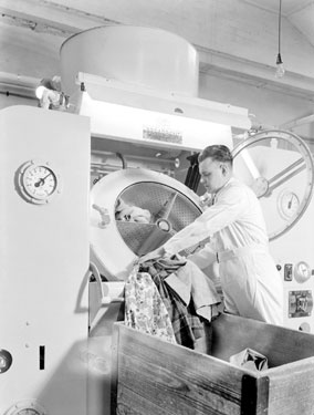 Thomas Broadbent & Sons Ltd: man loading 30 lbs Capacity Spring suspended non-flam dry cleaner