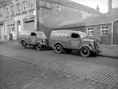 Two 'Frigidaire' Southern & Redfern Ltd. vans (Automatic Electric Refrigeration of Woodhead Road, Bradford) parked outside T. W. Broadbent Ltd