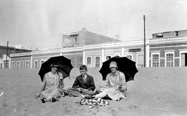 Two women and boy on beach