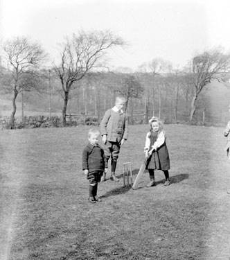 Douglas Family: John, Ailie, Sholto, playing cricket