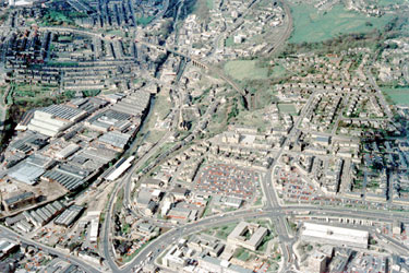 Aerial view of South West Huddersfield showing Springwood with Castlegate and Manchester Road leading up towards railway viaduct