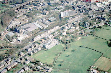 Aerial view of Nields Infants & Junior, Nields Road, Slaithwaite, showing Manchester Road from bottom left to top right