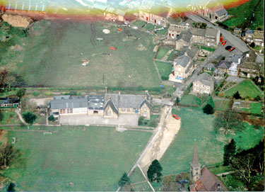 Aerial view of Helme Junior & Infant School & Slades Lane, Helme