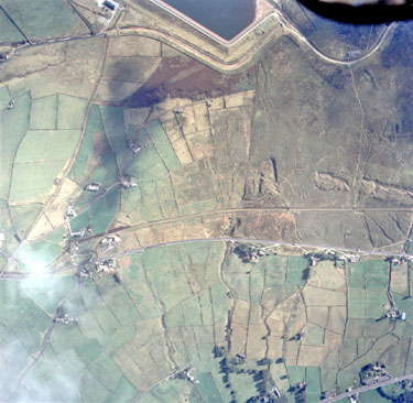 Aerial view of Meltham Road, Marsden with Deer Hill Reservoir at top