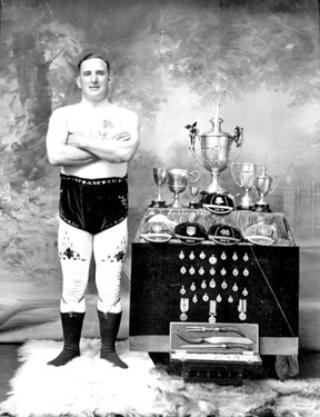 Portrait of man with trophies
