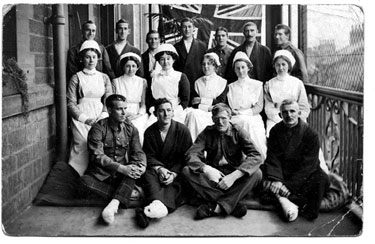 Informal Group Photograph of Nurses and Soldiers (Cook, and Mrs Rowlands written on the reverse of the postcard), at Holmfirth Auxiliary War Hospital.