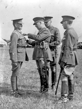 214 Battery Royal Artillery, Huddersfield Territorial Army - Bridlington Camp - CRA's Inspection - Presentation of the LS and GC Medal to BSM Brooke PSI, from left: Col. Skinner, Capt. Penfold and Col