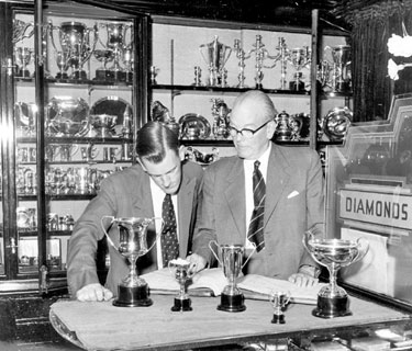 Messrs. Fillans & Sons Ltd, Jewellers, No.2 Market Walk - Mr Archie Fillan with son Ian - interest in local clubs & societies brings orders for cups and trophies.