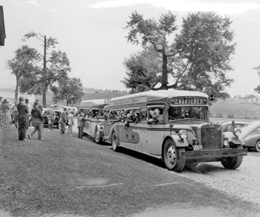 Young evacuees, children of Hoover Employees sent to USA in WWII: buses arrive at 'Hoover Camp'.