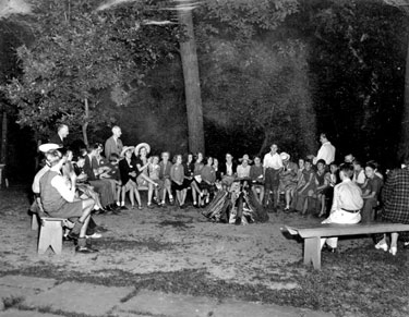 Young evacuees, children of Hoover Employees sent to USA in WWII:singing around campfire.