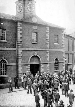 People gathered outside the old Cloth Hall, Market Street, Huddersfield