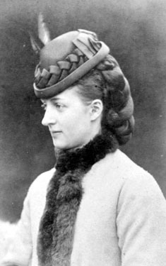 Young woman wearing a hat.
