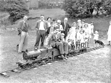 Group around model railway, Greenhead Park, Huddersfield 	