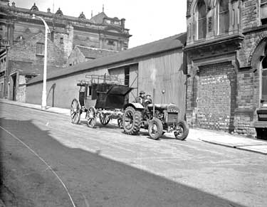 Tractor Towing old carriage from fire station, Huddersfield 	