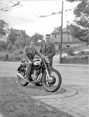 W J Netherwood and R Oakes with motorcycle 	