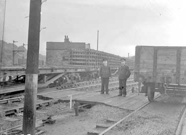Train leaving with pre-fabricated rails, with Station Masters, Greetland 	