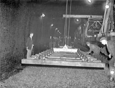 Railway Tunnel: lifting old rails 	
