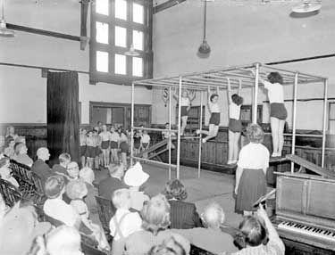Schoolchildren performing on apparatus 	